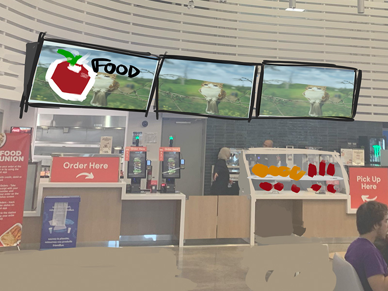 The screens were brought closer together to better visual harmony,  and there was a suggestion to make the menu screens display more obvious pictures and graphics so people can see what this area sells at a glance. The seating was also re-arranged to make getting around easier and to make all the furniture less disconnected.