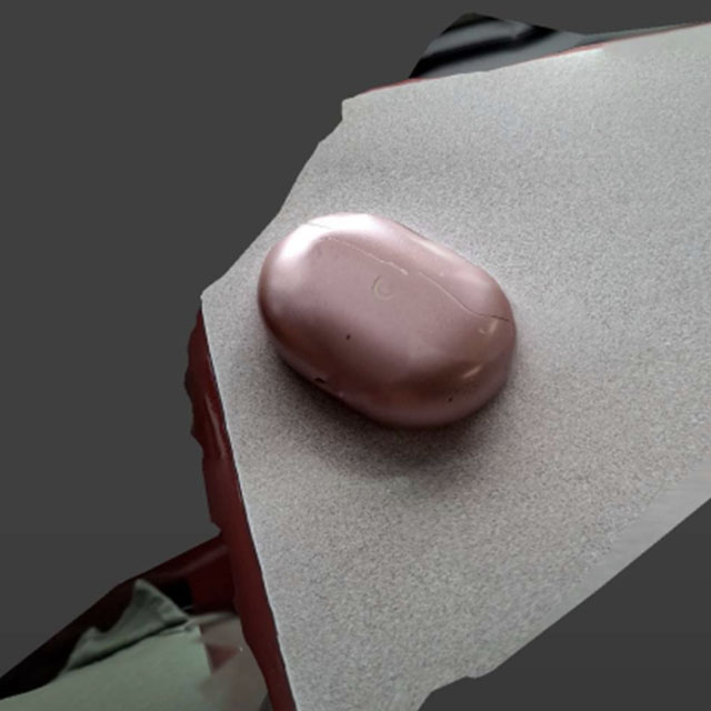 This is a scan of my headphone case, and where I realised why shiney objects were hard to scan. It doesn't show from this angle, but the area with the bright glare had a weird hole once I processed the scan into a mesh.